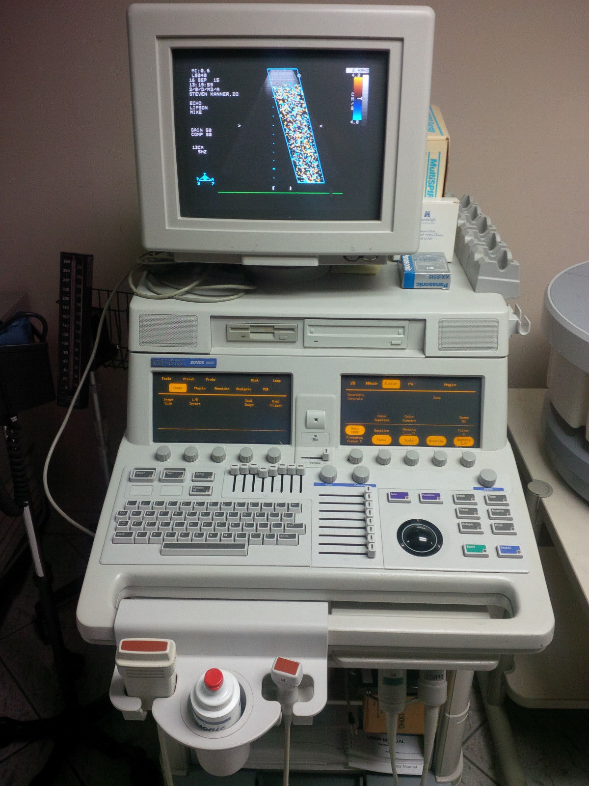 a computer monitor sitting on top of a table