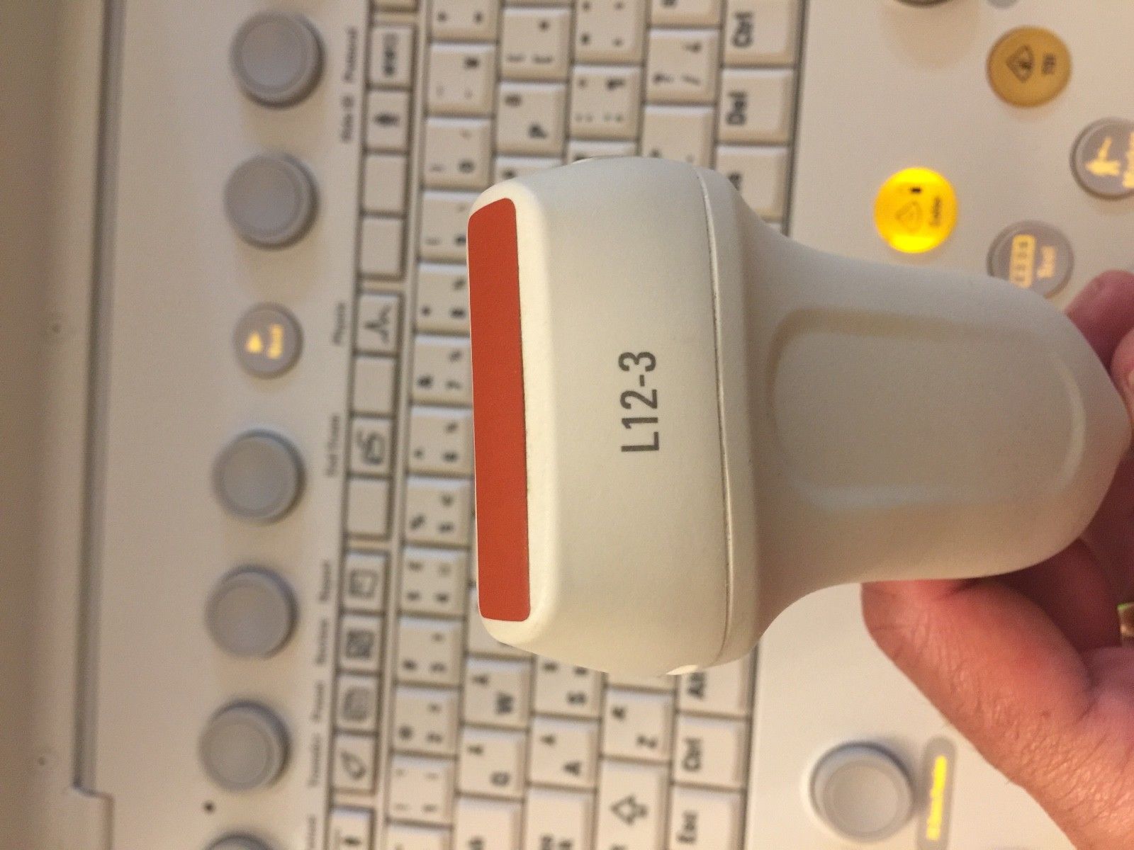 a close up of a person's hand holding an electronic device