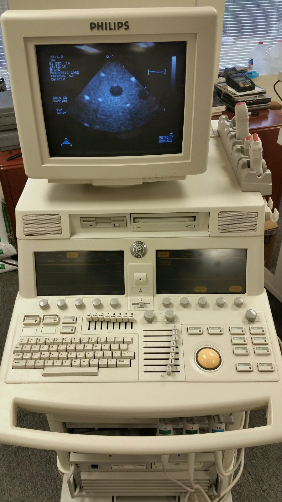 a computer monitor sitting on top of a desk