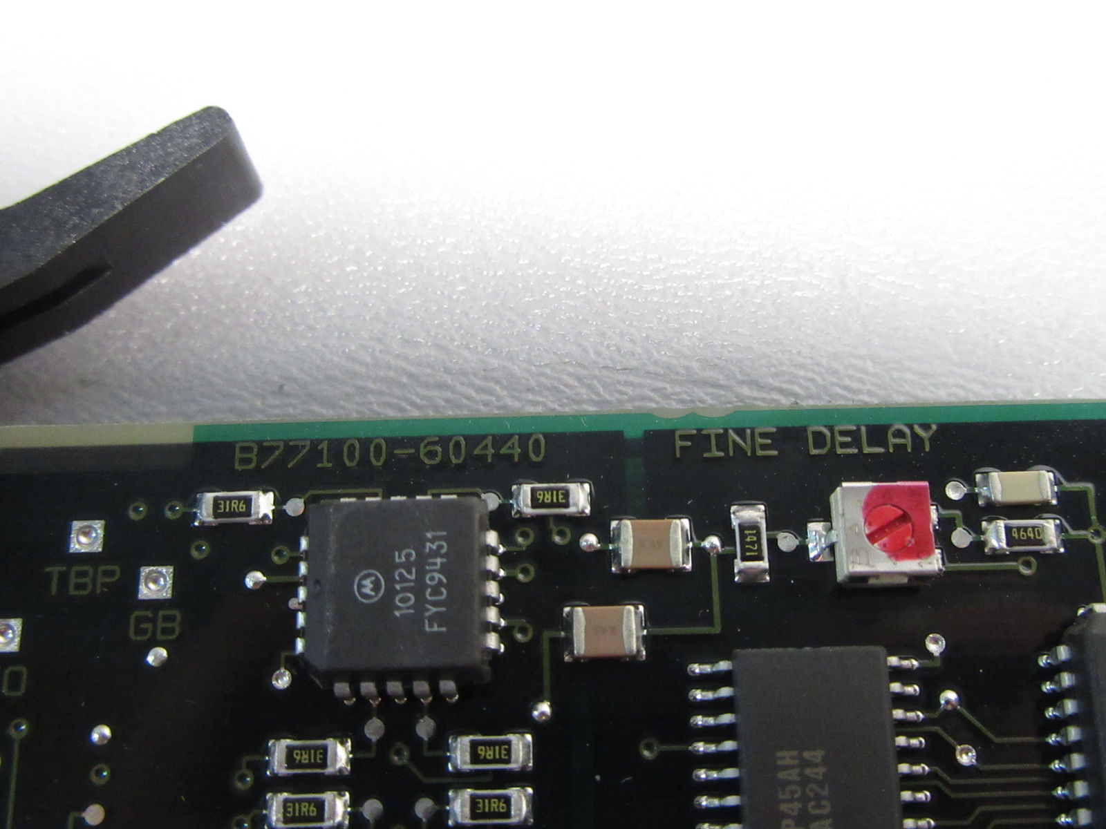 a close up of a circuit board with a red light on it