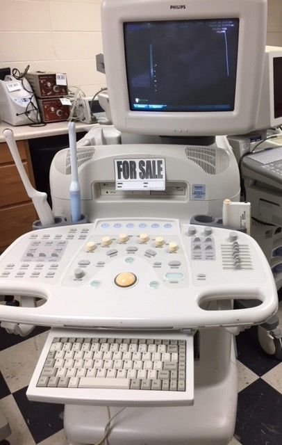 a hospital room with a monitor and other medical equipment