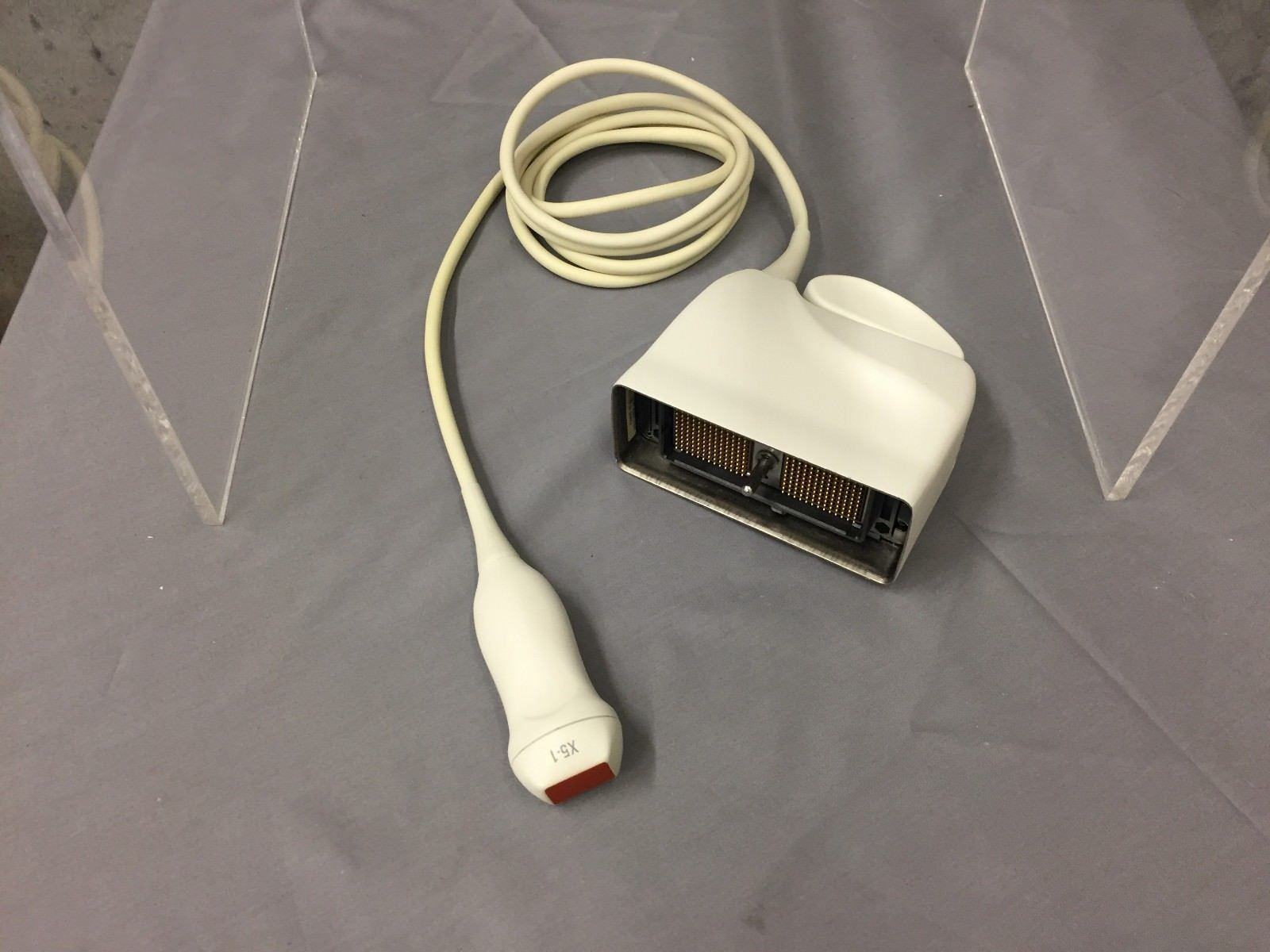 a white probe with a cord attached to it