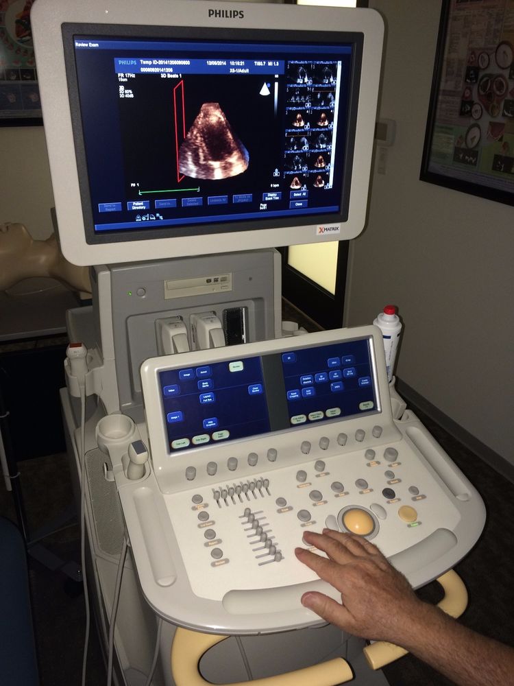 a person operating a machine with a monitor on top of it