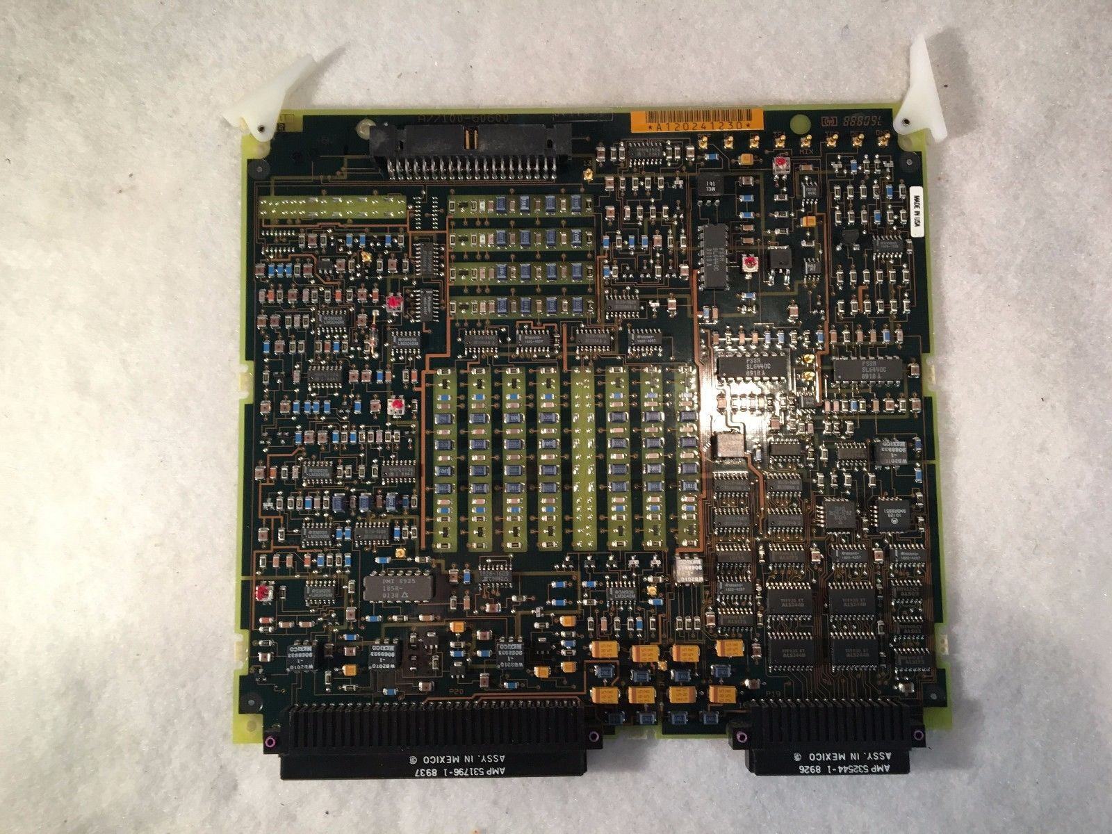 a close up of a computer motherboard on a white surface