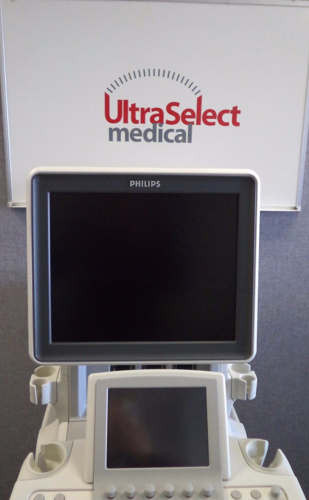 a medical machine with a monitor on top of it