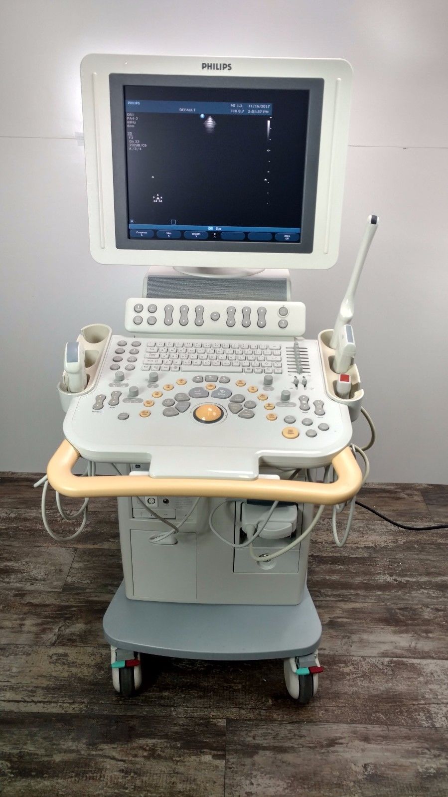 a laptop computer sitting on top of a medical cart