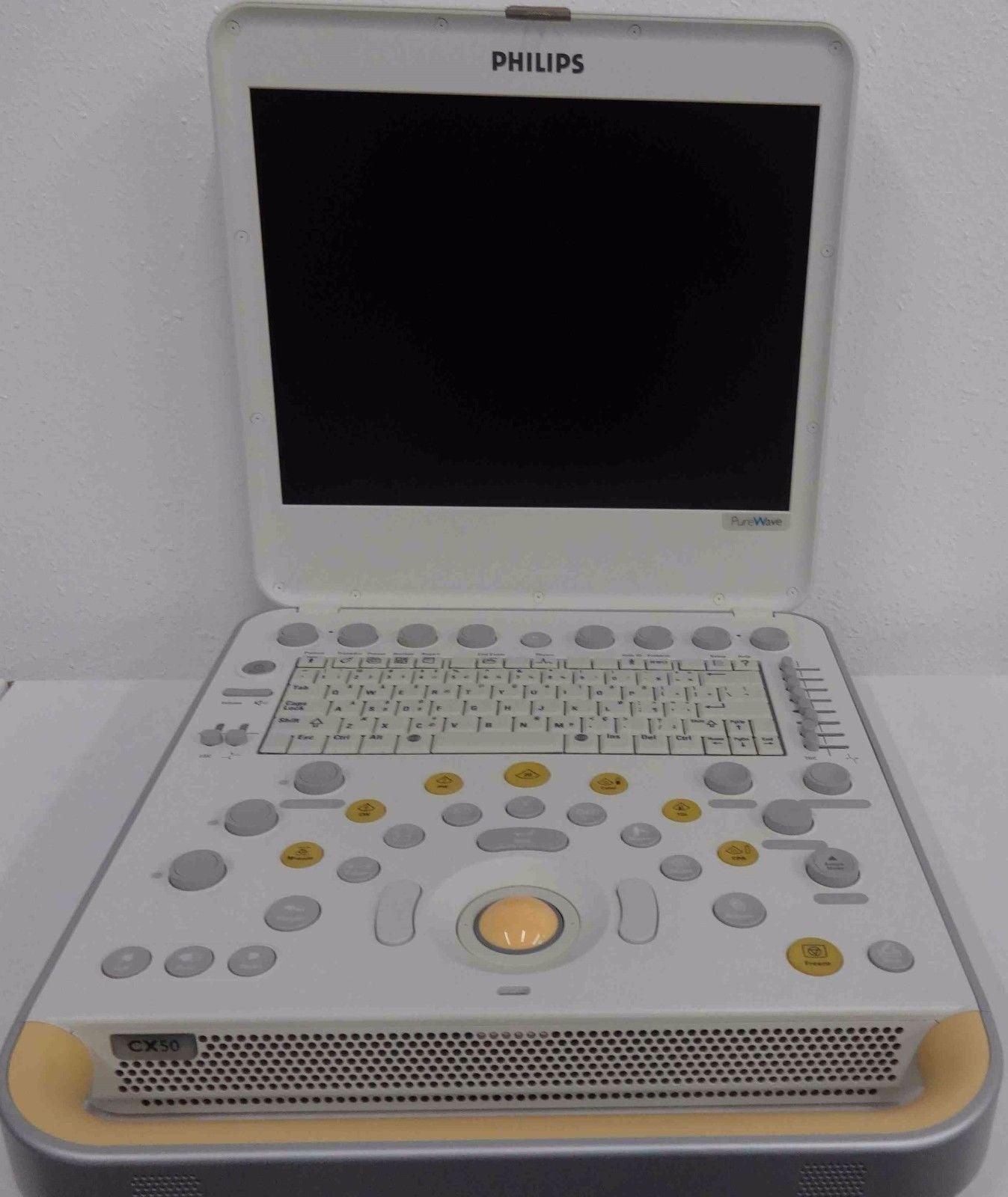 a laptop computer sitting on top of a white table