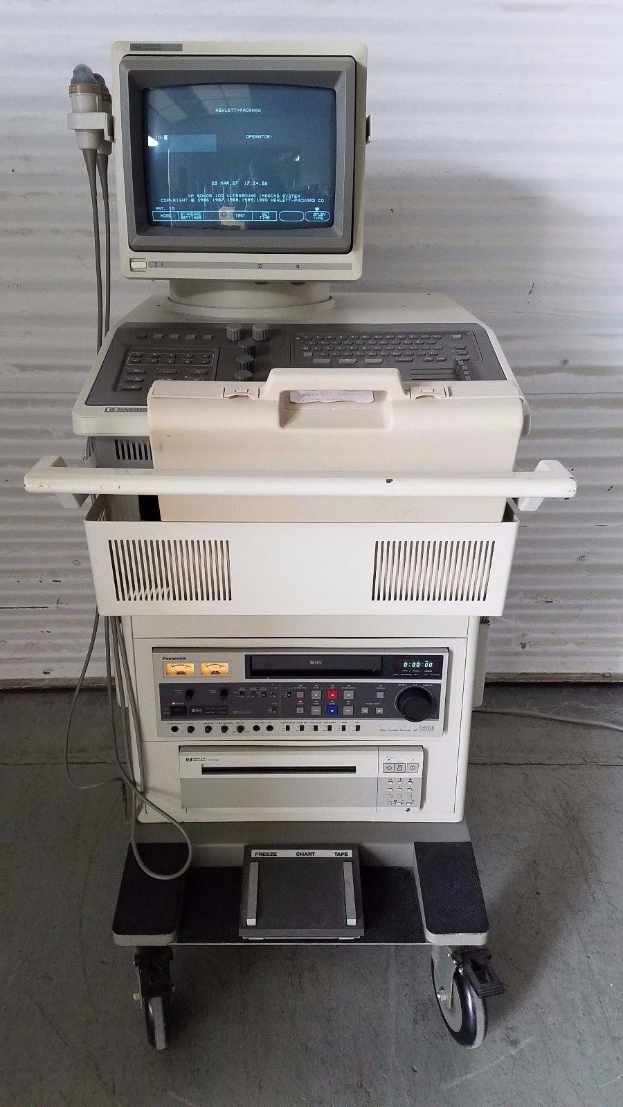 a laptop computer sitting on top of a cart