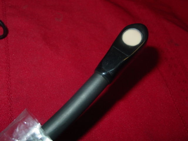 a close up of a baseball bat on a red cloth