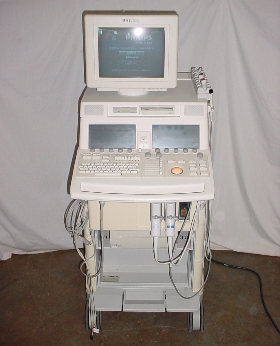 a laptop computer sitting on top of a medical cart