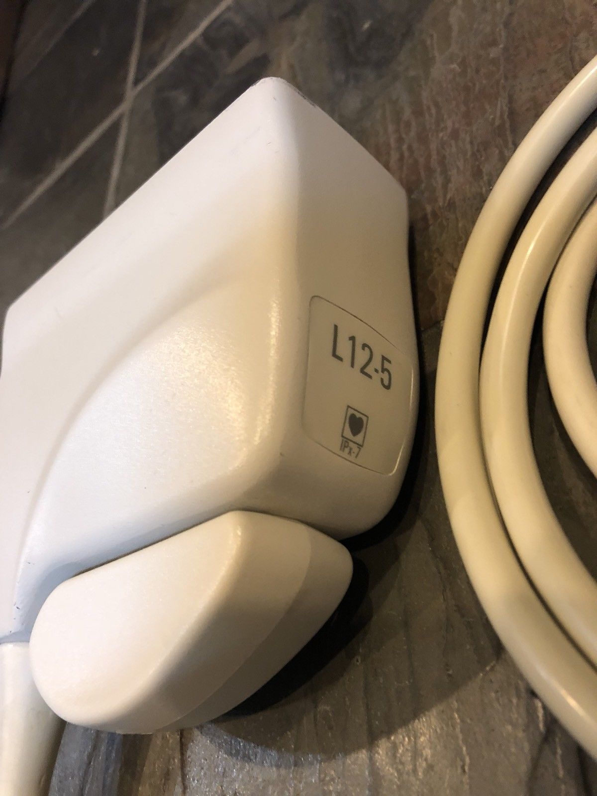 a close up of a white electrical device on a table