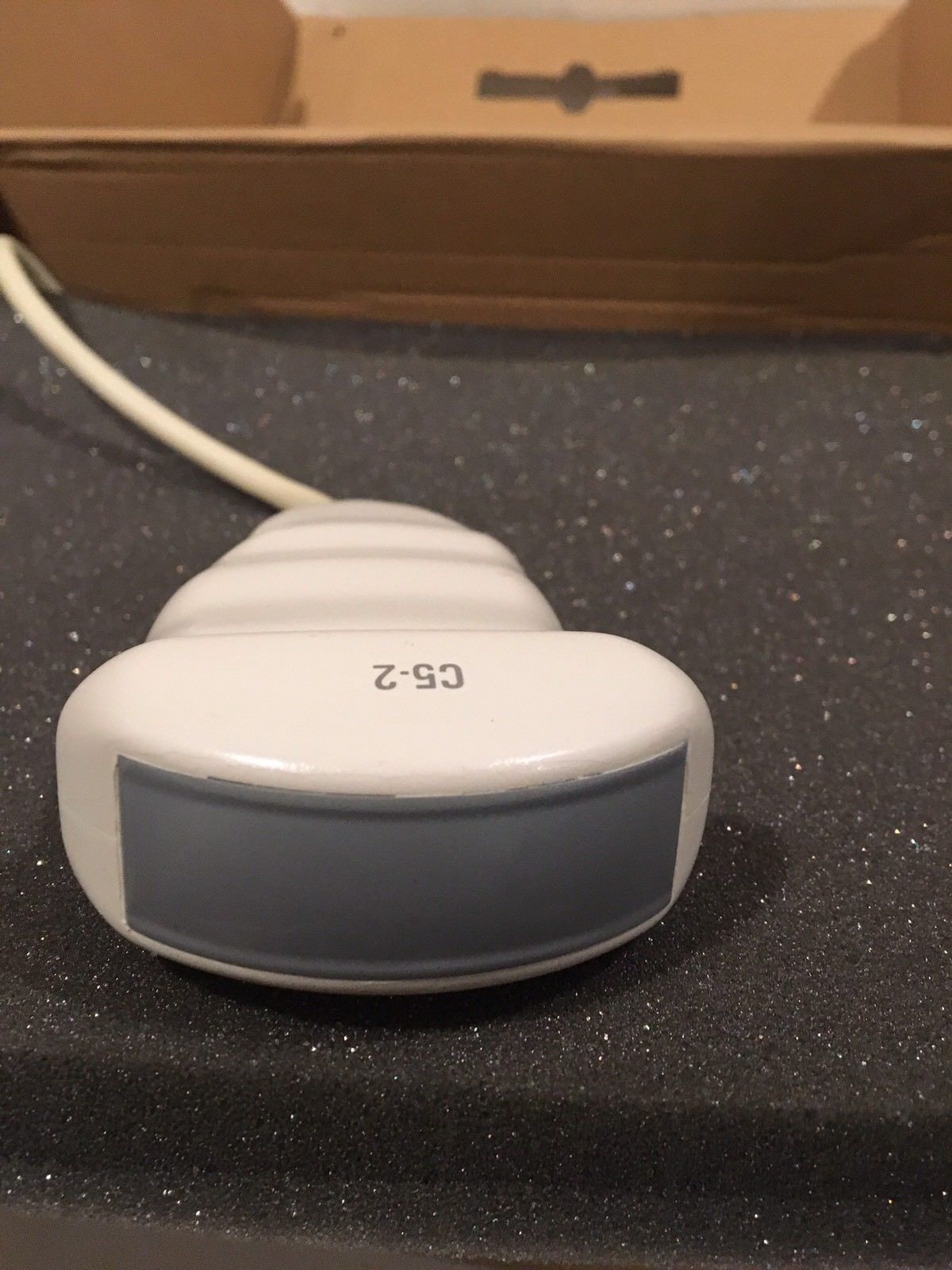 a white electronic device sitting on top of a table