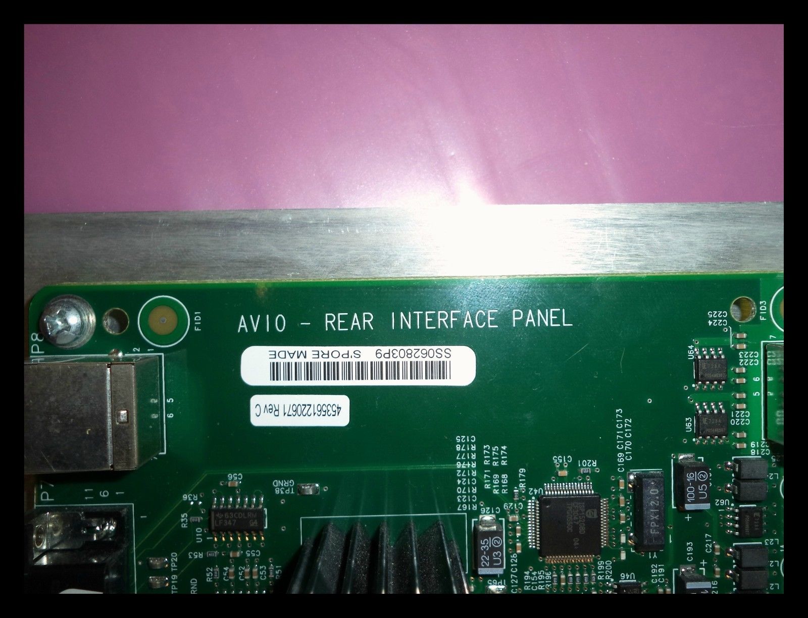 a close up of a green electronic board