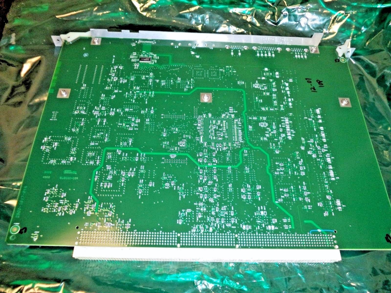 a close up of a green electronic board