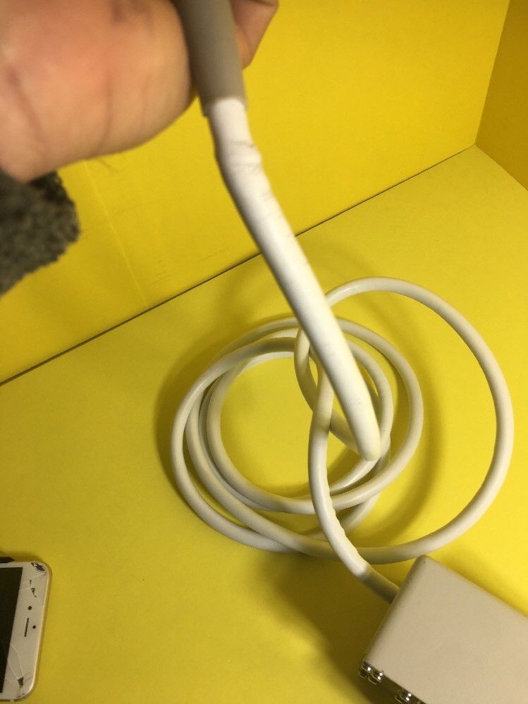 close up of small device with yellow background