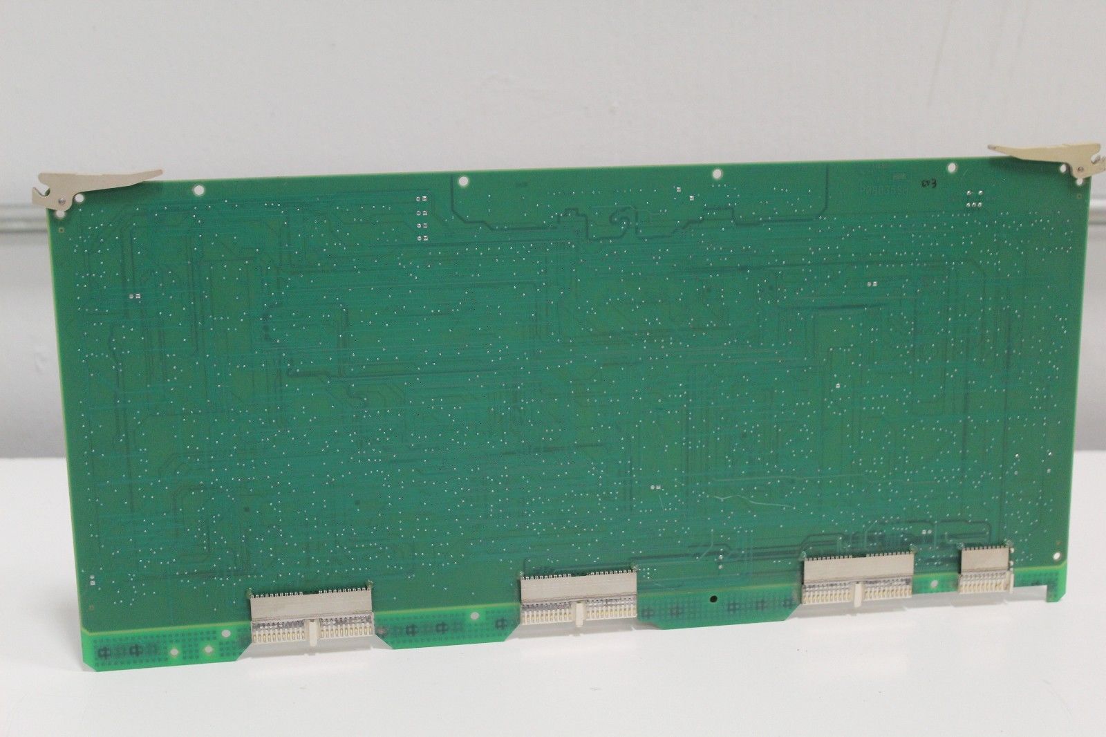 a close up of a green electronic board