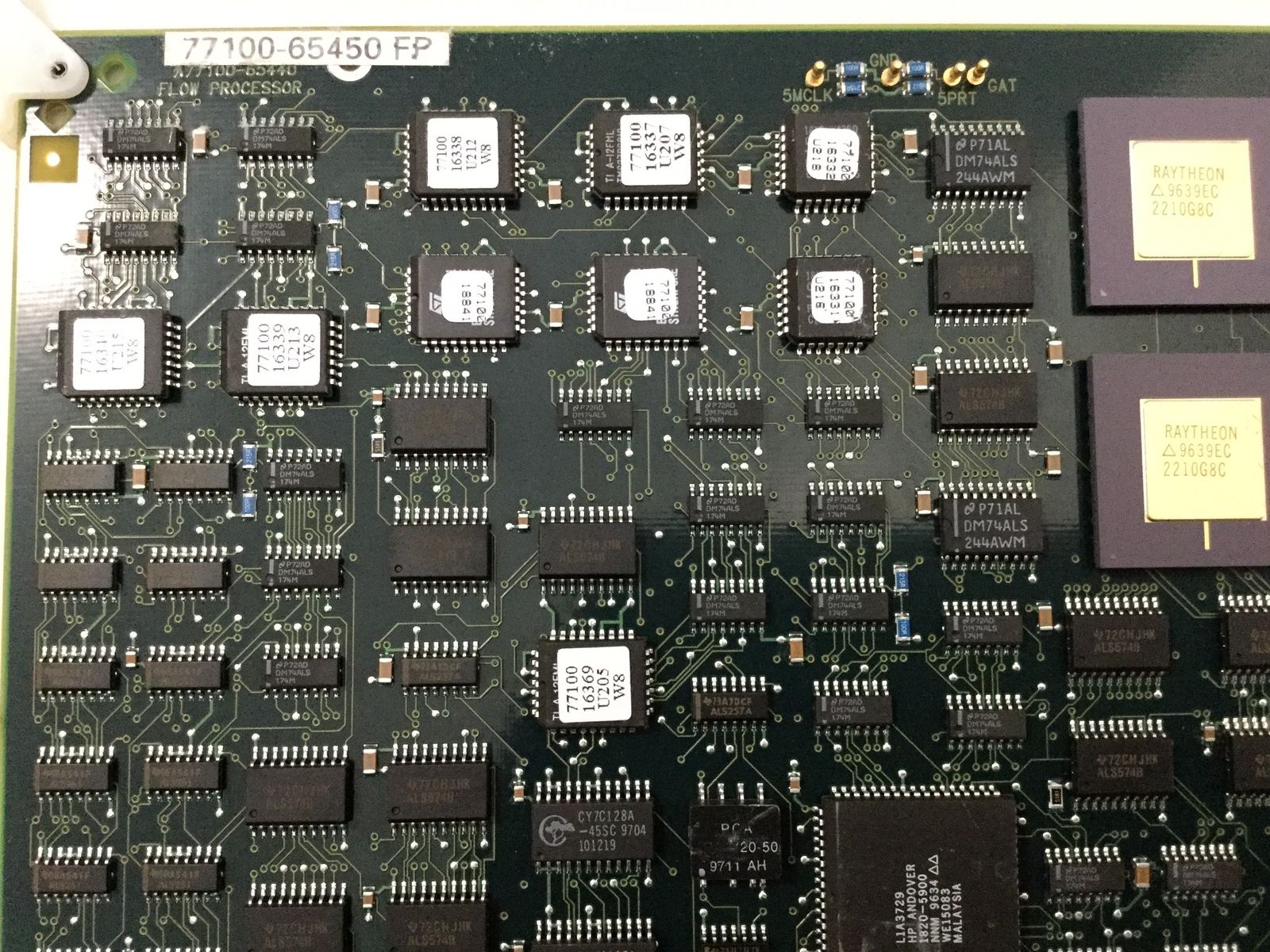 a close up of a computer board with many electronic components