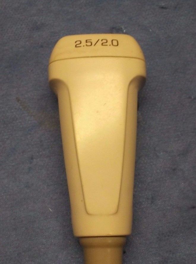 a close up of a yellow object on the ground