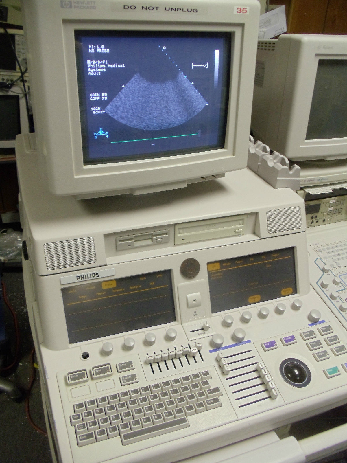 a computer monitor sitting on top of a desk