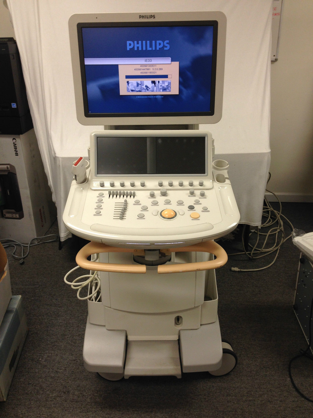 a medical machine with a monitor on top of it