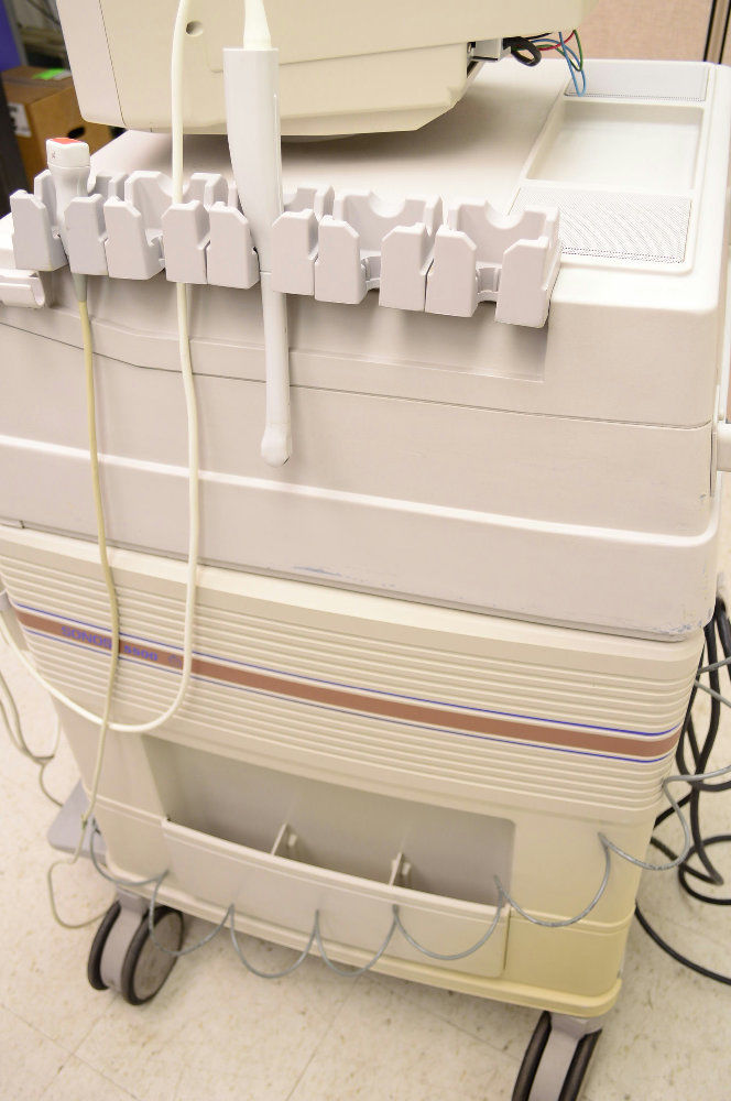 a large white machine sitting on top of a table