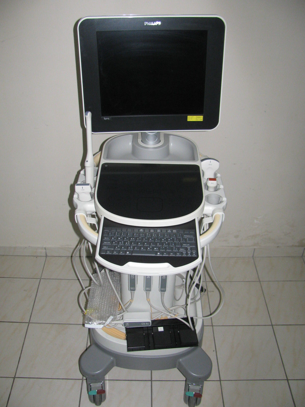 a laptop computer sitting on top of a medical cart