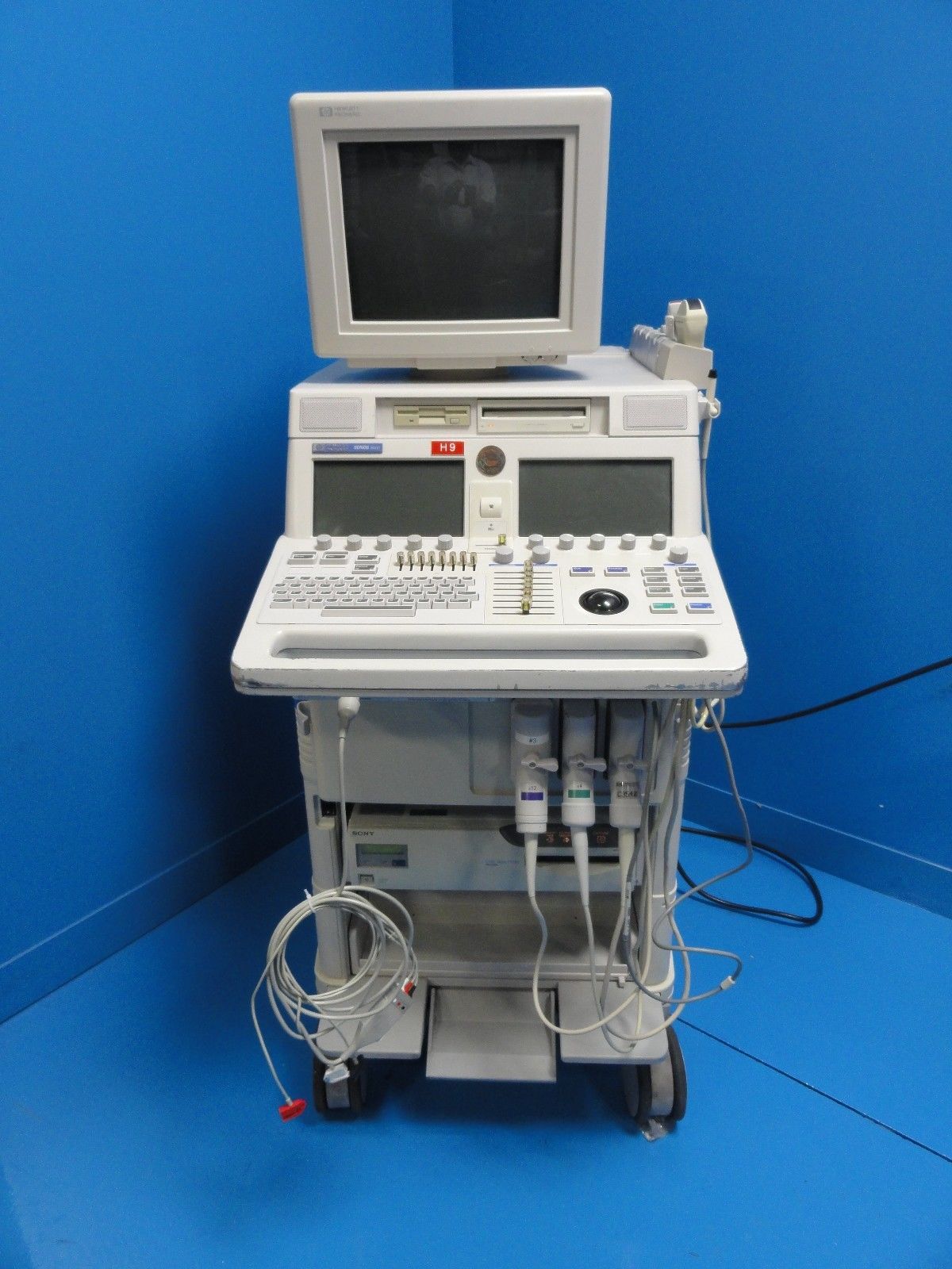 a medical machine with a monitor on top of it