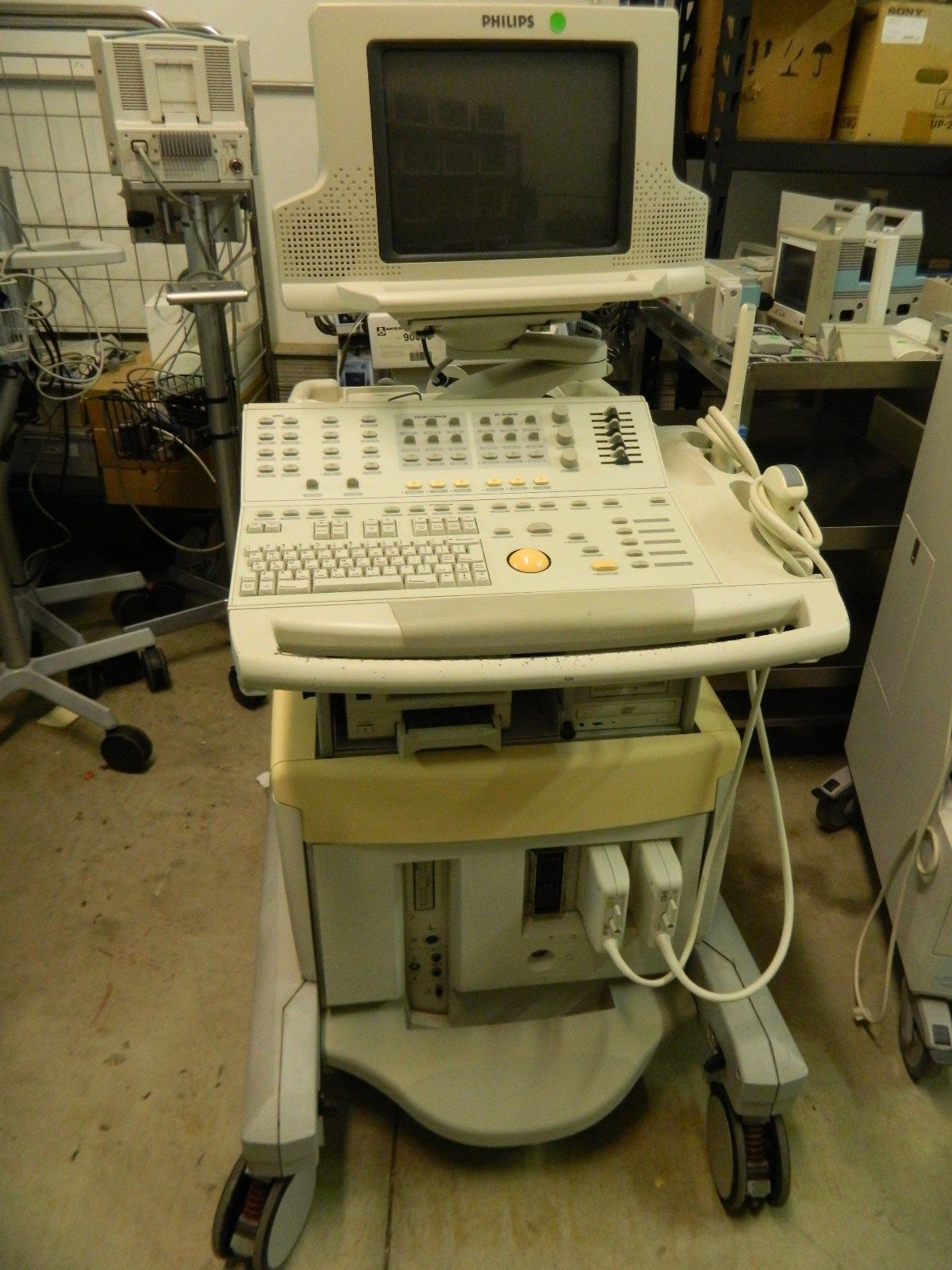 a computer sitting on top of a cart in a room