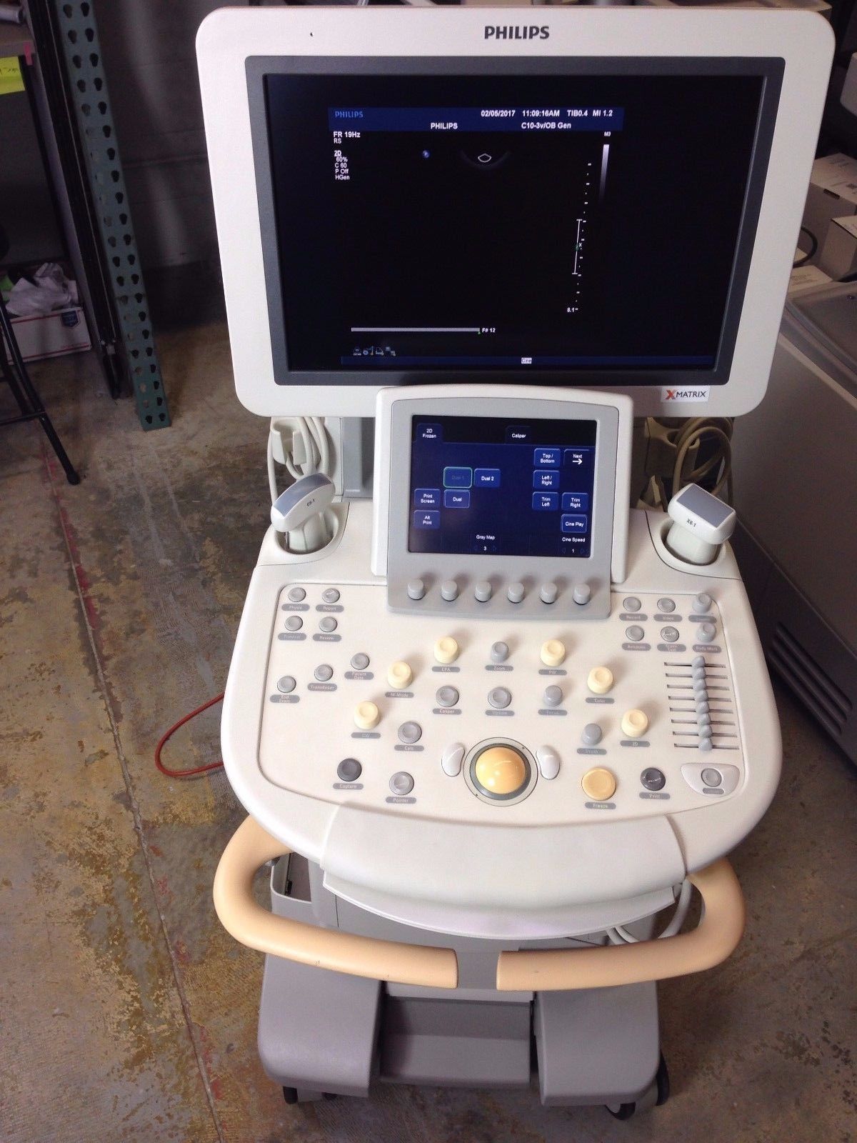 a medical machine with a monitor on top of it