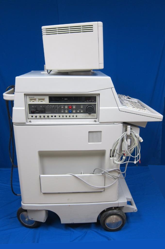 a white machine sitting on top of a blue table