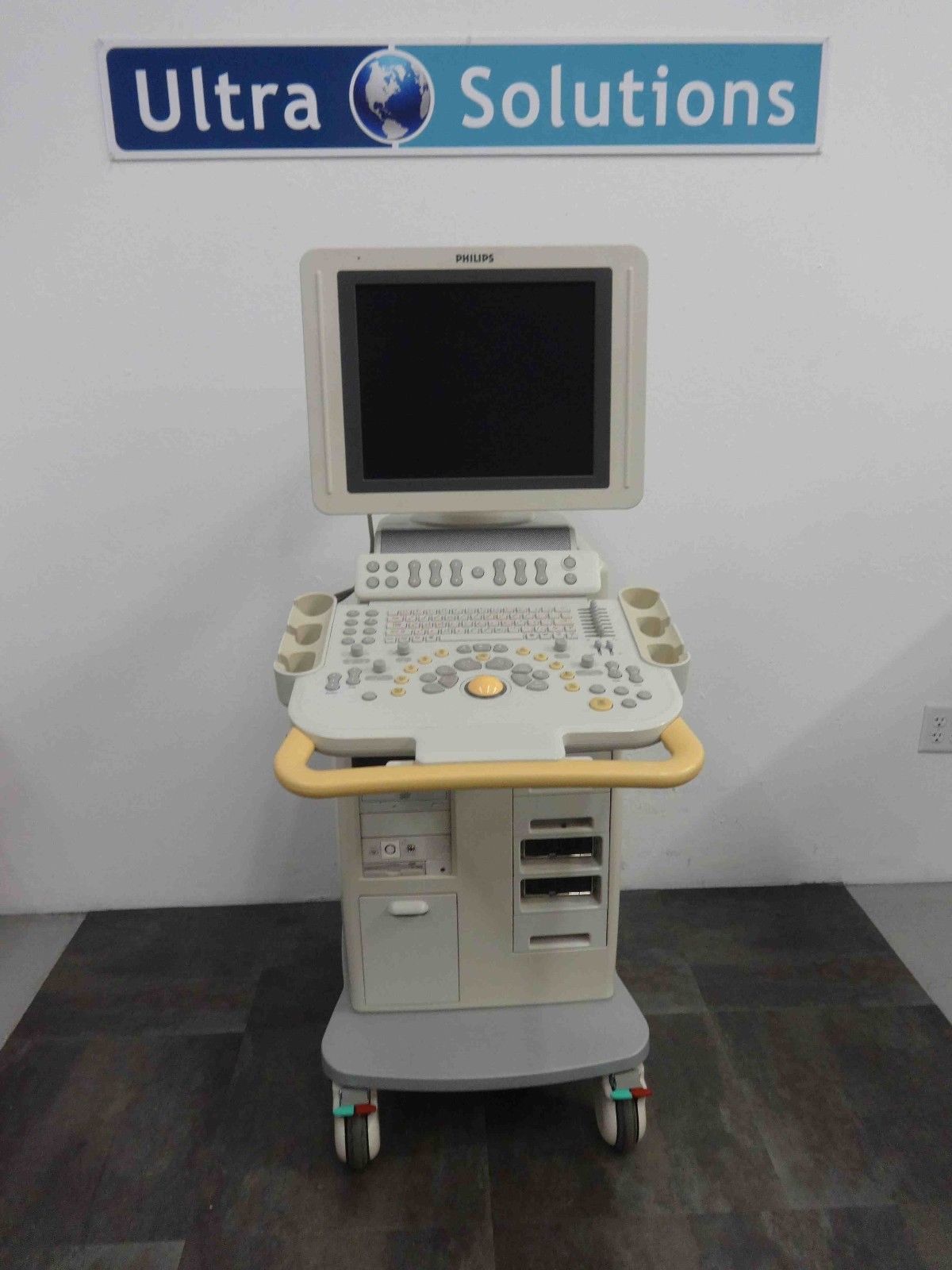 a laptop computer sitting on top of a cart