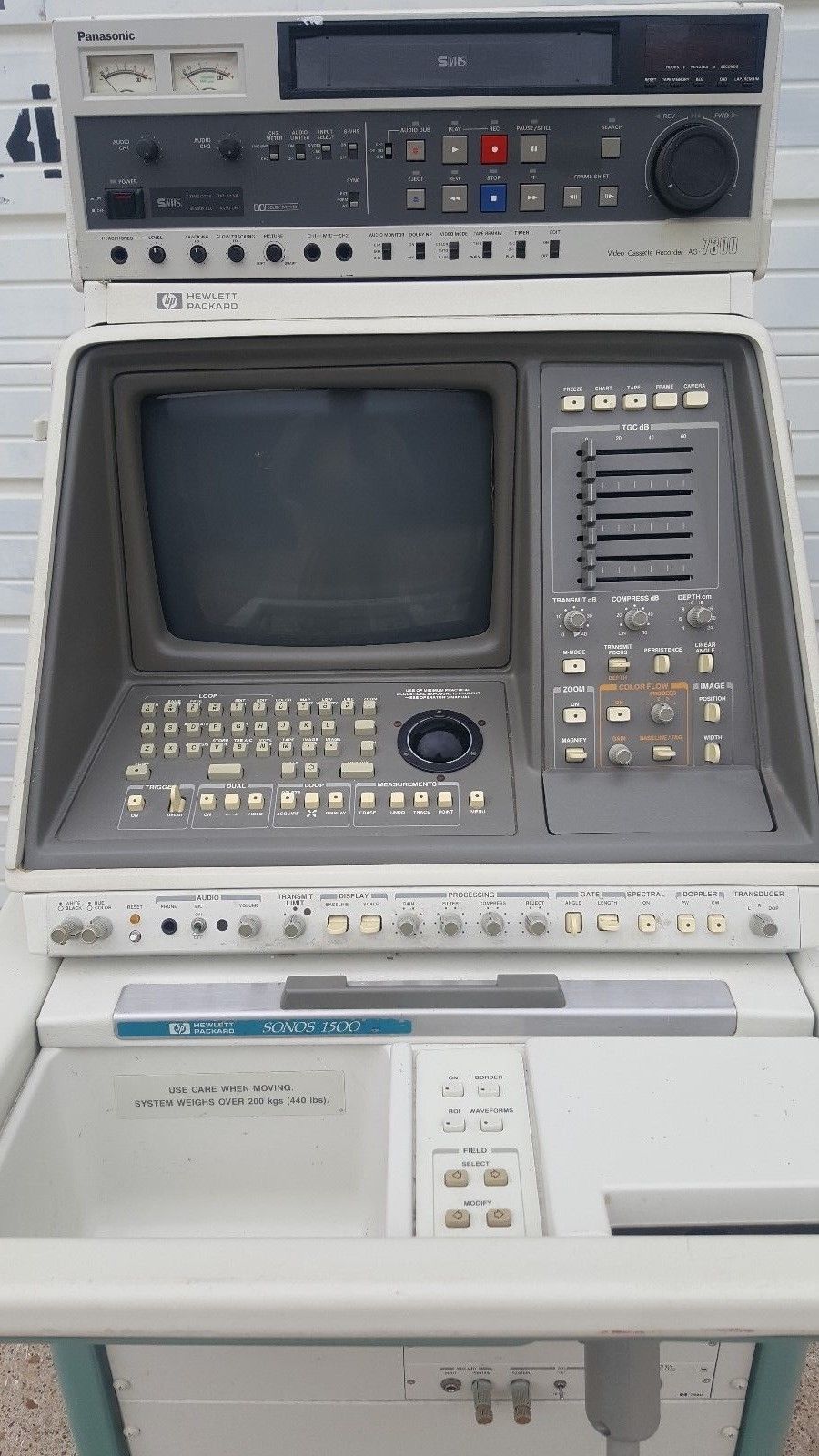 an old computer sitting on top of a table