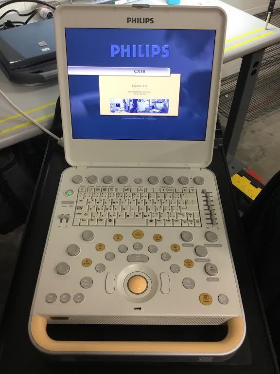 a laptop computer sitting on top of a table