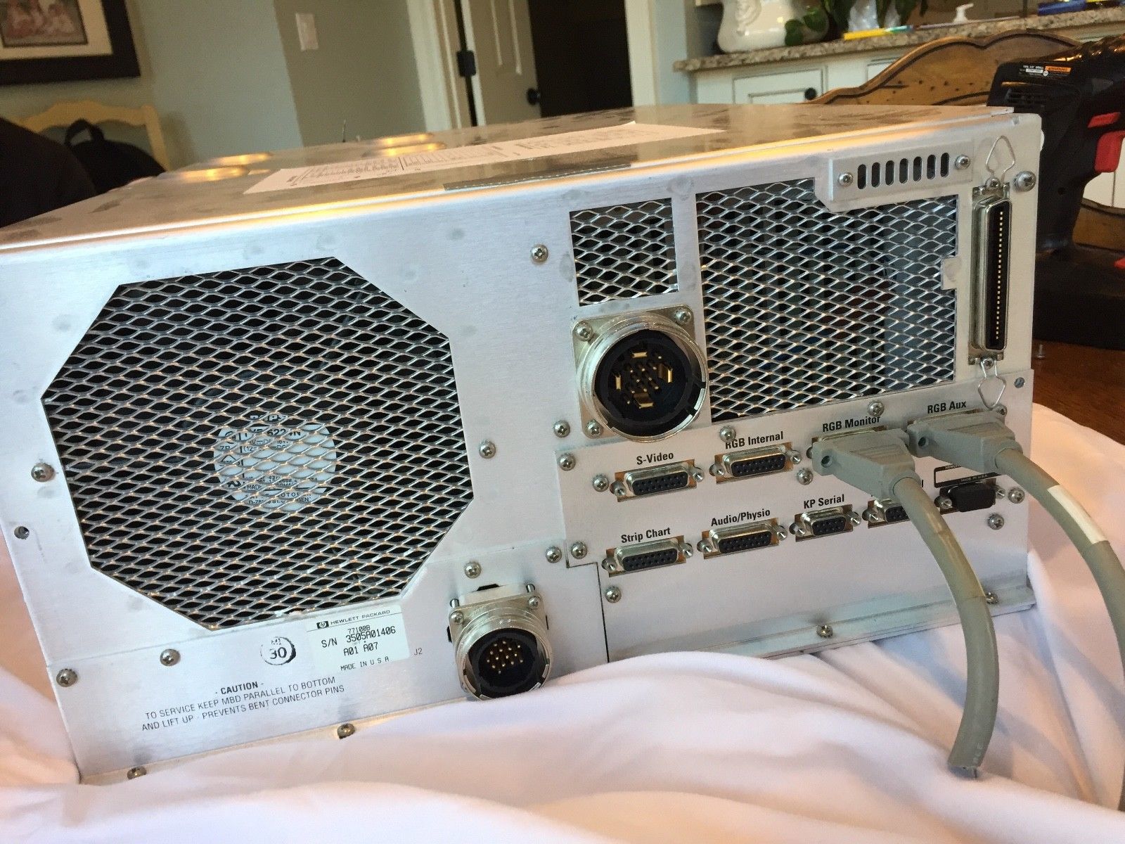 a machine sitting on top of a white sheet