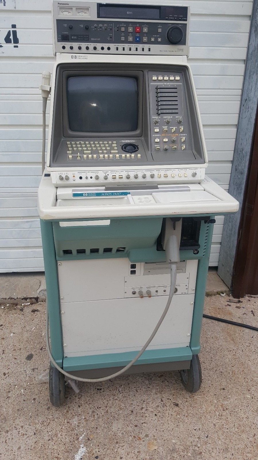 an old computer sitting on top of a cart