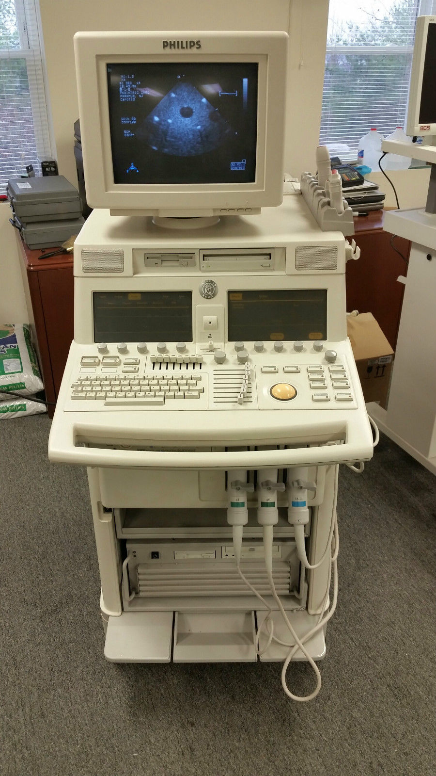 a computer monitor sitting on top of a white desk
