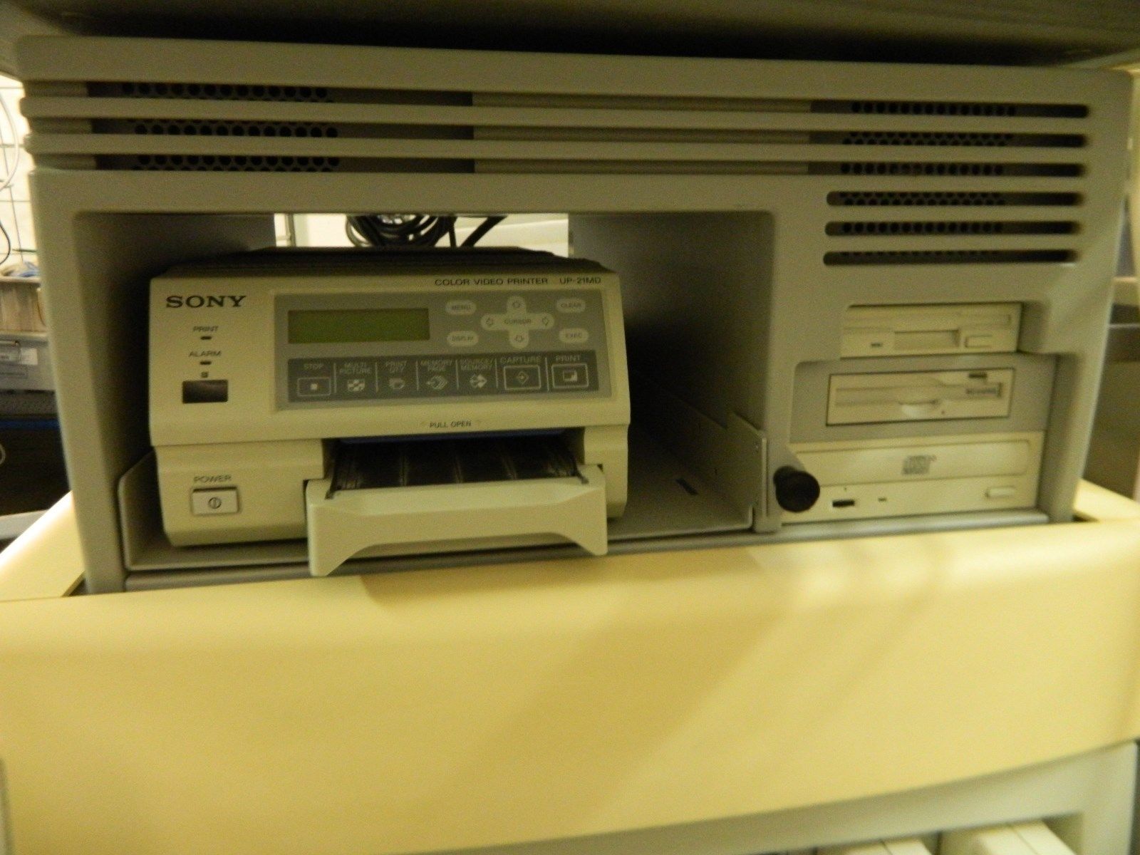 a printer sitting on top of a yellow table