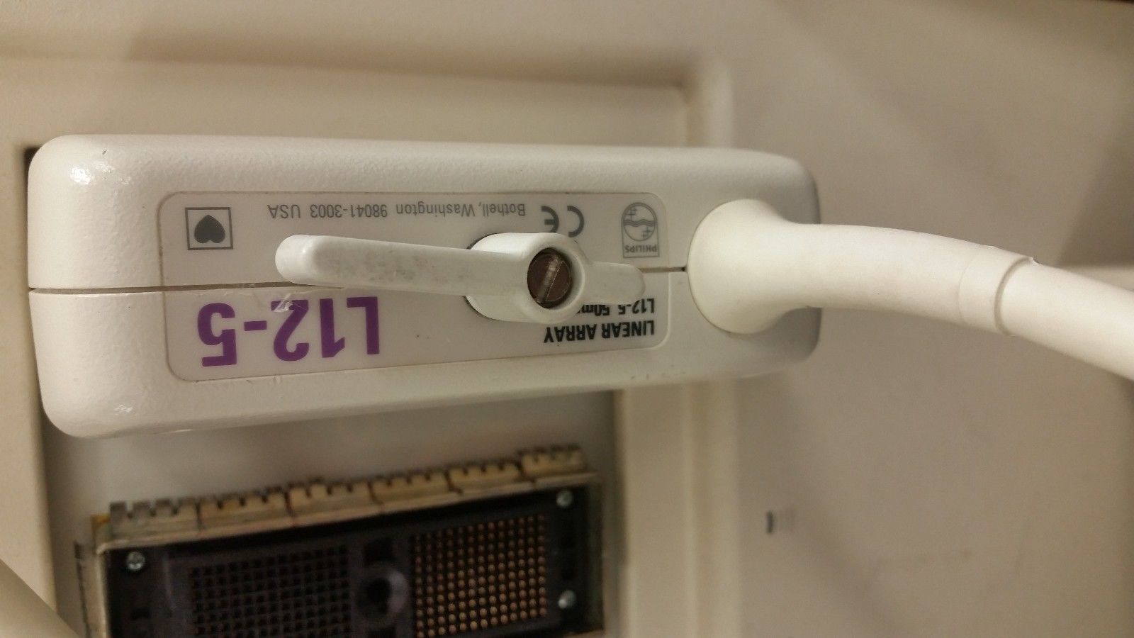 a close up of a probe controller plugged into ultrasound