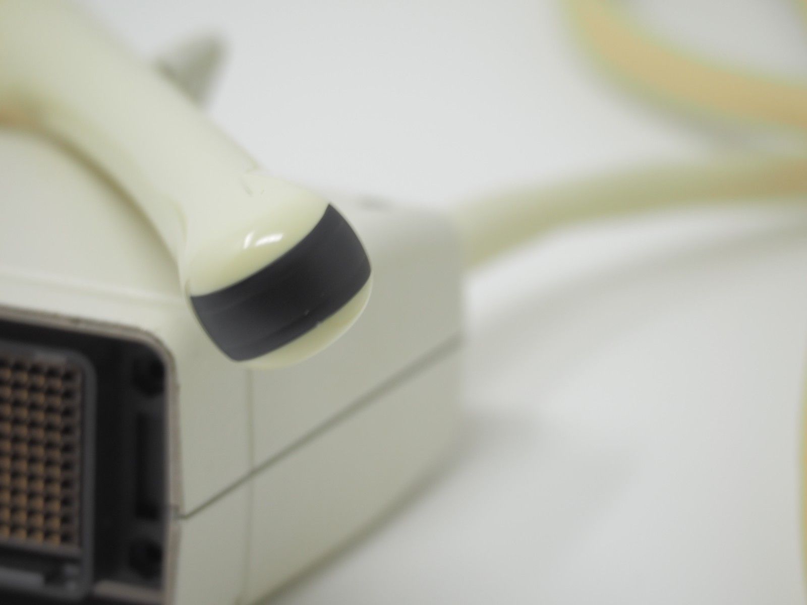 a probe head sitting on top of a white table