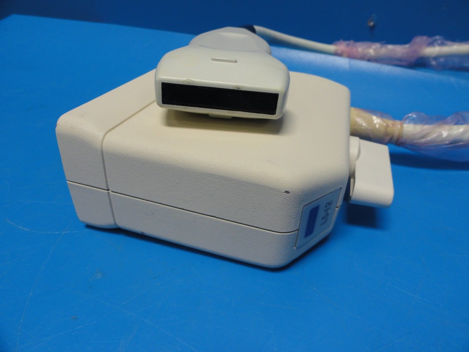 a white device sitting on top of a blue table