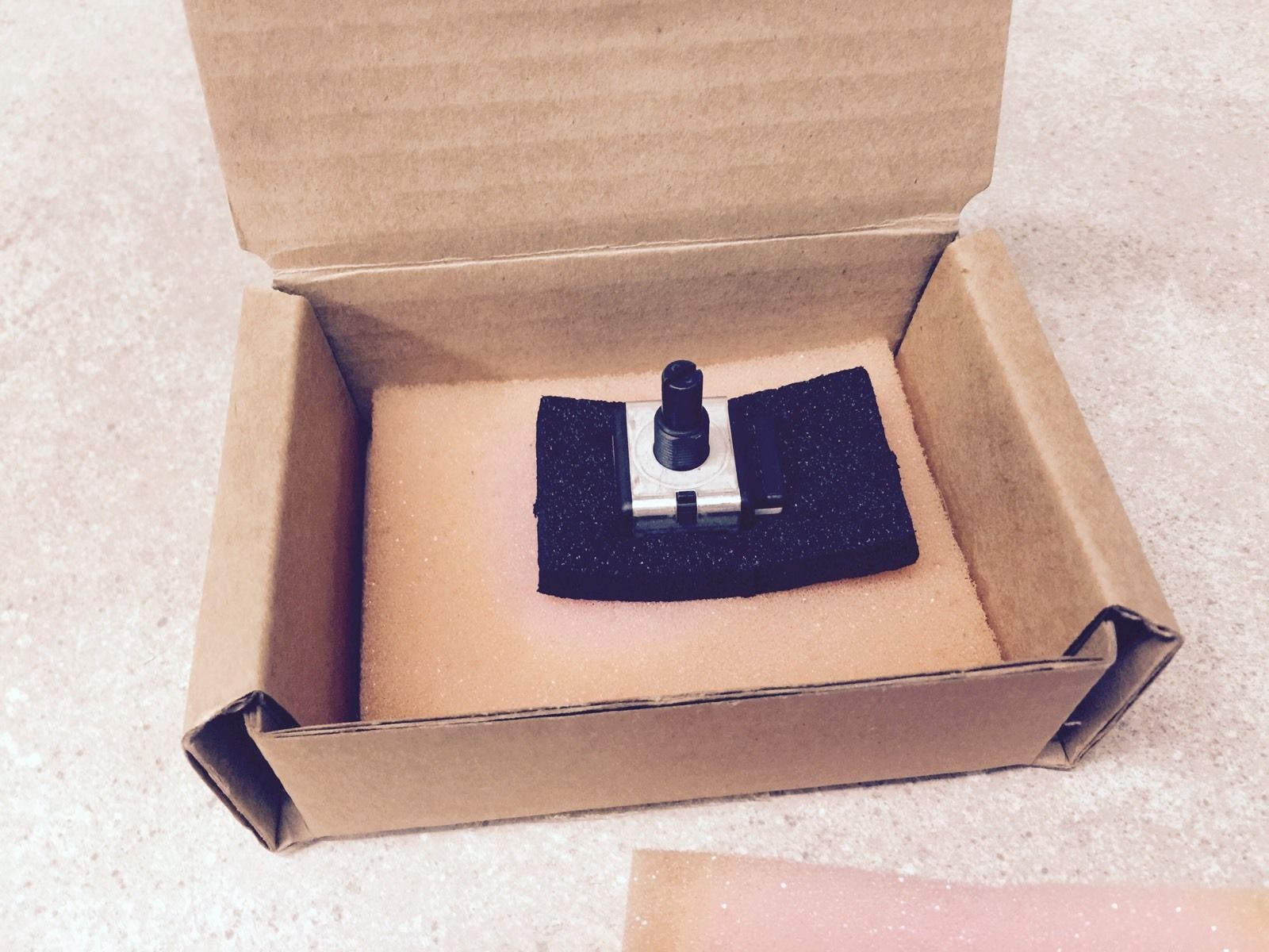 cardbaord box with black machine