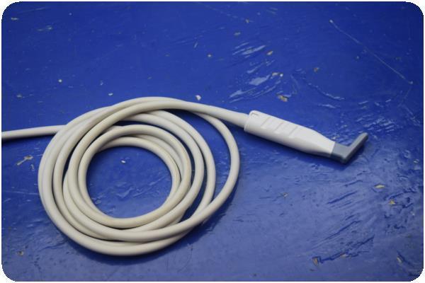 a white extension cord on a blue surface