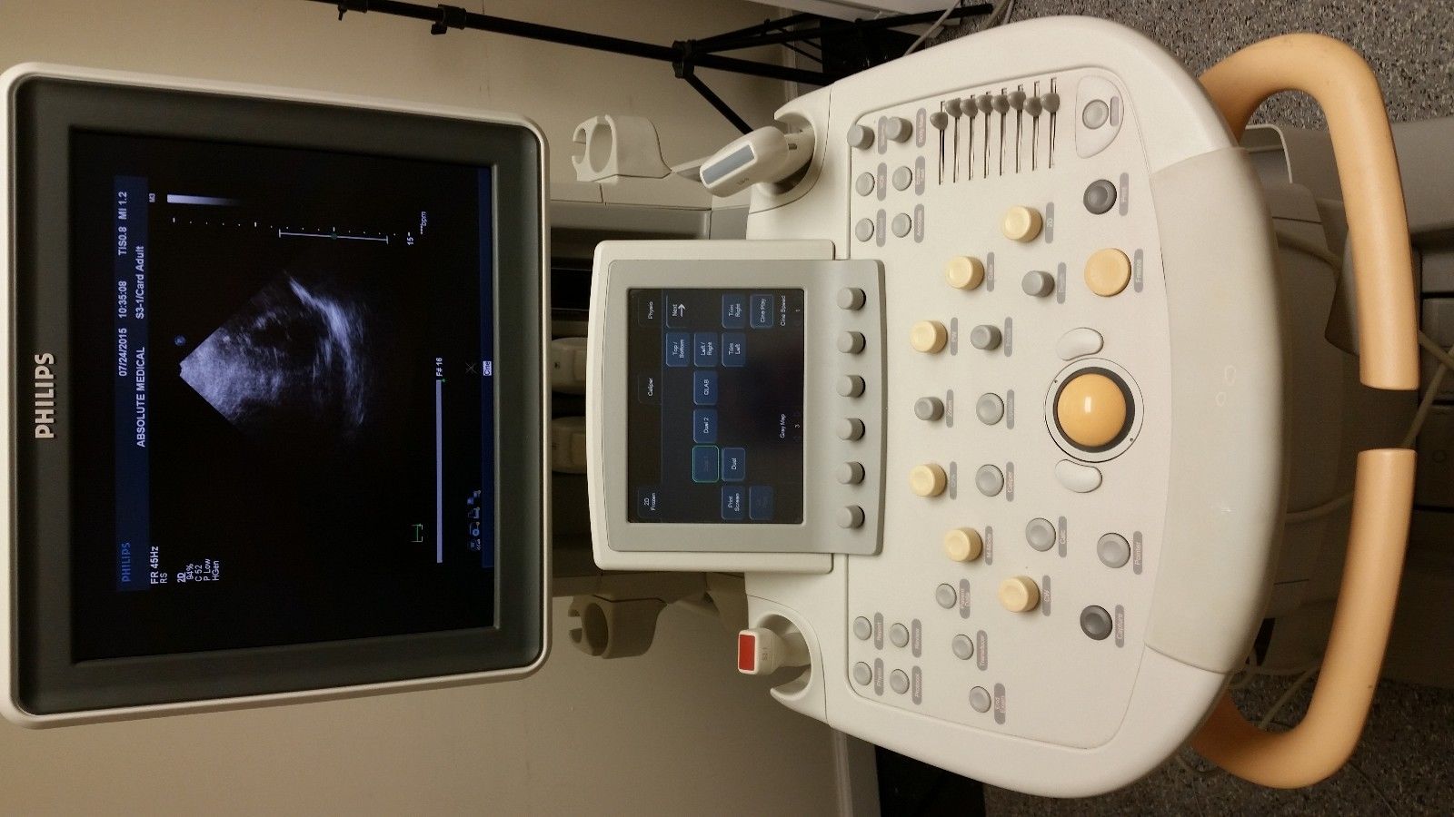 a medical machine with a monitor on the wall