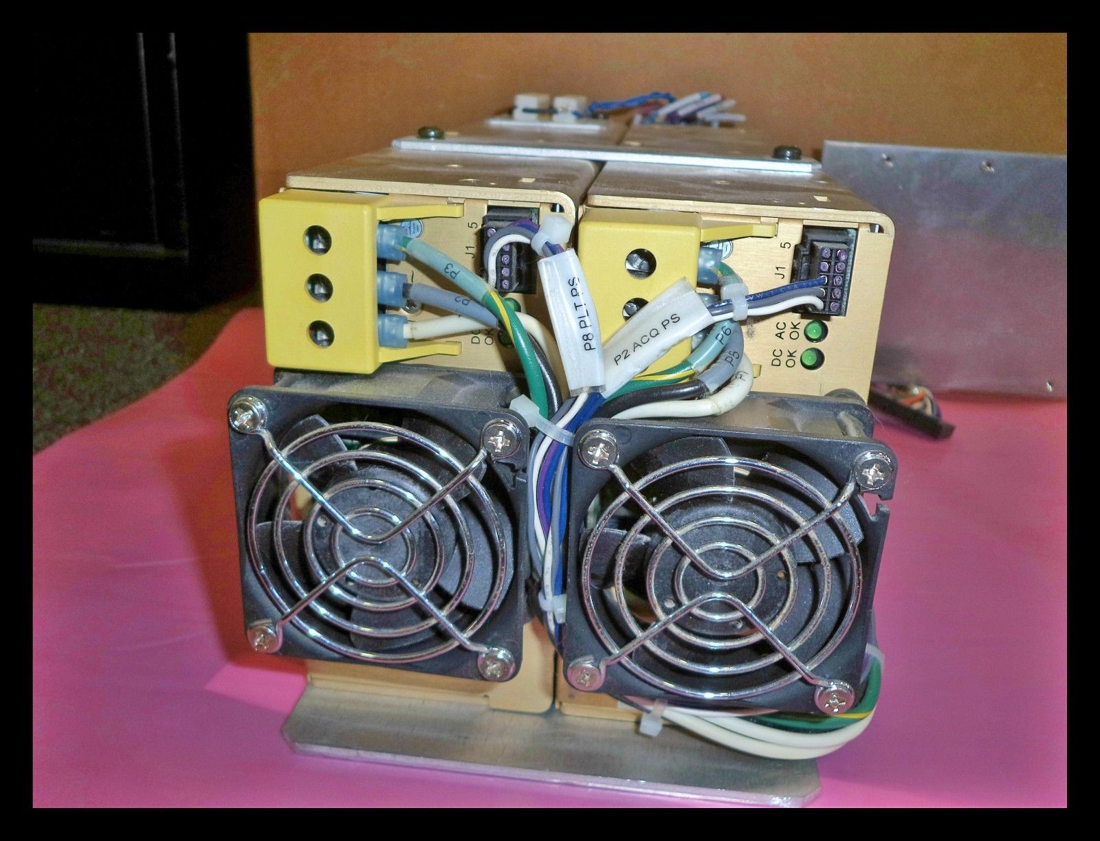 a couple of computers sitting on top of a table