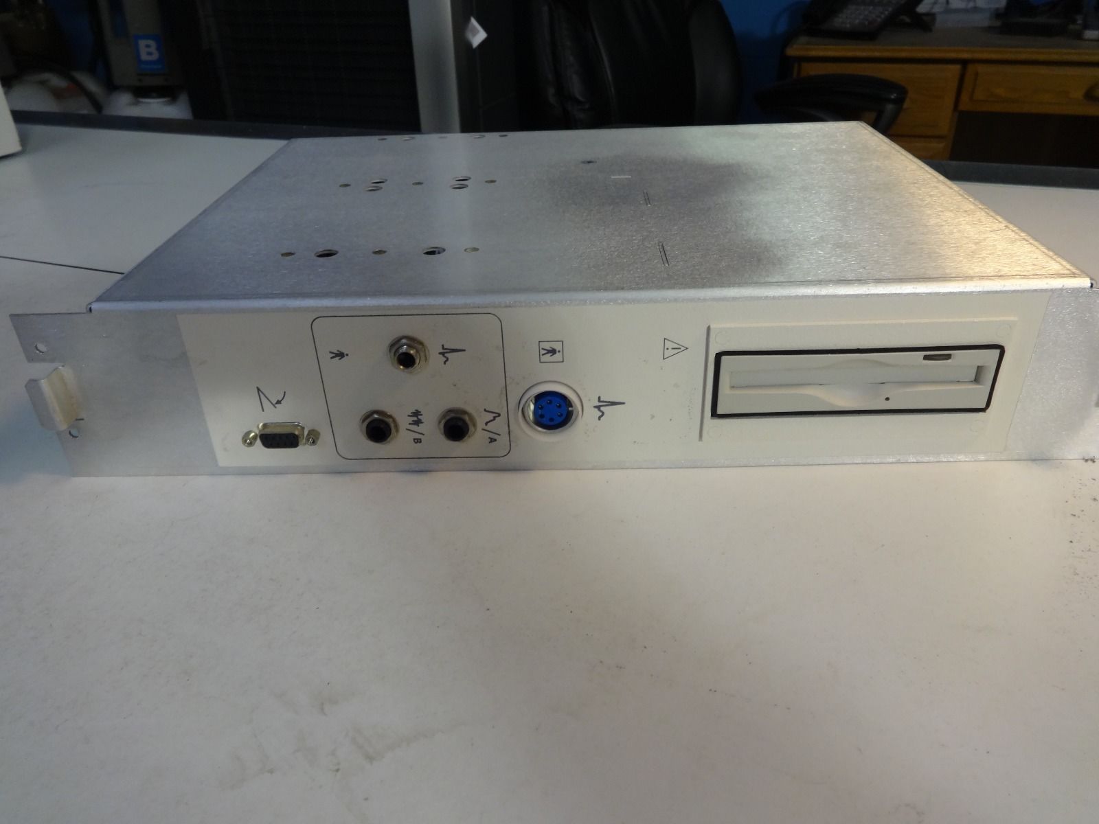 a silver electronic device sitting on top of a table