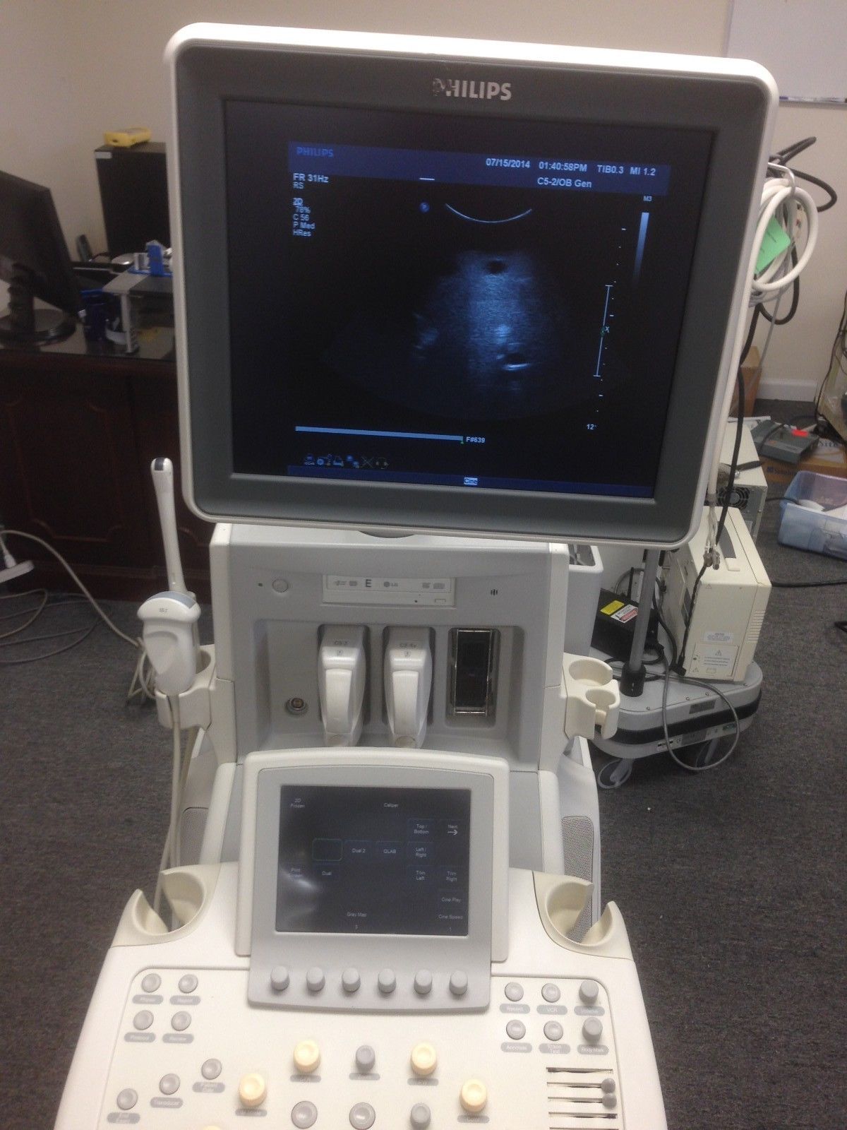 a medical machine with a monitor on top of it