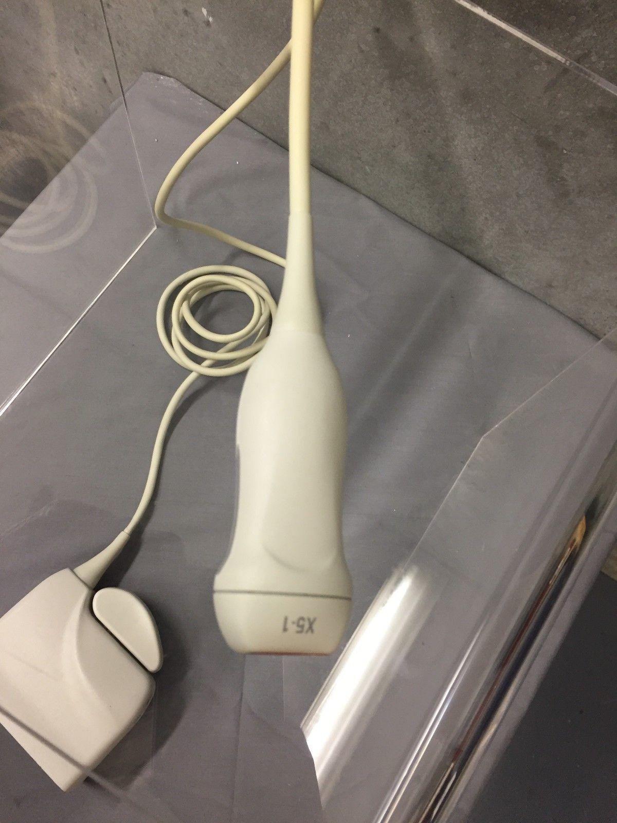 a white electric probe sitting on top of a table