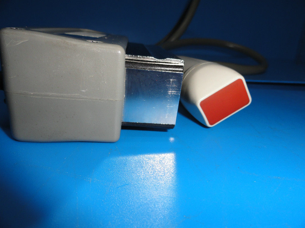 a red and white object sitting on top of a blue table